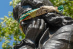 Bristol, UK. Statue of Edward Colston with blindfold before it was taken down by protestors. 6 May 2020. 